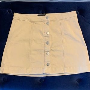 Tan stretch mini skirt with button down detail